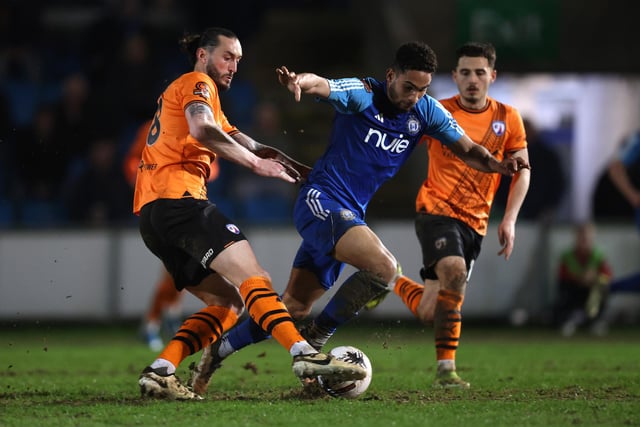 HALIFAX, ENGLAND - MARCH 20: Aaron Cosgrave of FC Halifax Town is challenged by Oliver Banks of Chesterfield during the Vanarama National League match between FC Halifax Town and Chesterfield at The Shay on March 20, 2024 in Halifax, England.  (Photo by George Wood/Getty Images)