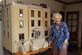 Mrs Marlene Dyson with the dolls house.