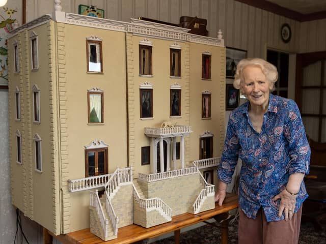 Mrs Marlene Dyson with the dolls house.