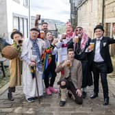 The cast of the Heptonstall Pace Egg have a Good Friday pint in the village between performances in Weavers Square