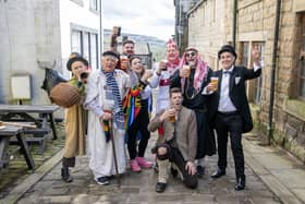 The cast of the Heptonstall Pace Egg have a Good Friday pint in the village between performances in Weavers Square