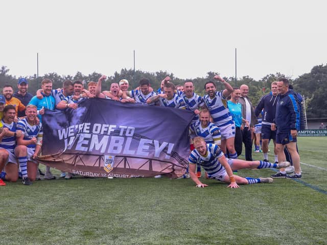 Halifax Panthers players and staff celebrate after winning their 1895 Cup semi-final against London Broncos