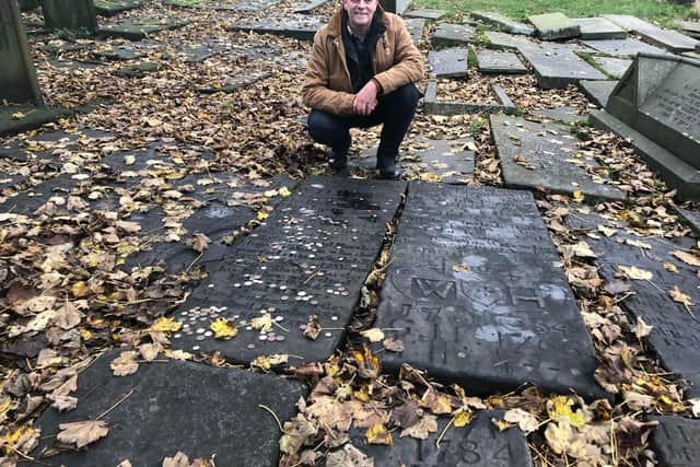 Steve Hartley, pictured in Heptonstall graveyard, has written about the 18th century Cragg Vale Coiners, of which his relative 'King' David Hartley was the leader.