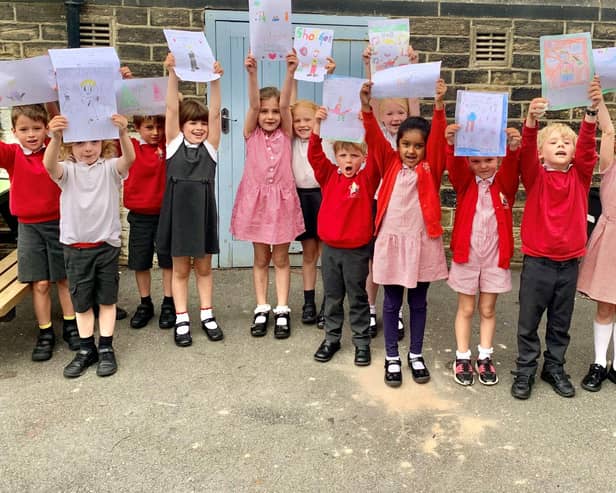 All Saints' CE Primary School pupils with their George Ezra posters
