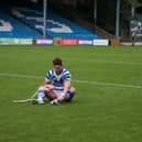 Halifax Panthers players dejected after Swinton Lions crushed their hopes of reaching the play-offs in what turned out to be Simon Grix's last game in charge. (Photo by Simon Hall.)