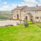 The appealing farmhouse has panoramic views, with an annexe that can be used as a source of income.