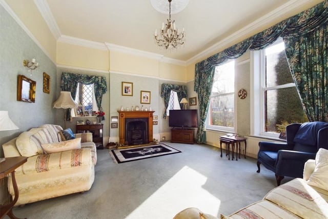 This lounge is one of three sizeable reception rooms within the property.