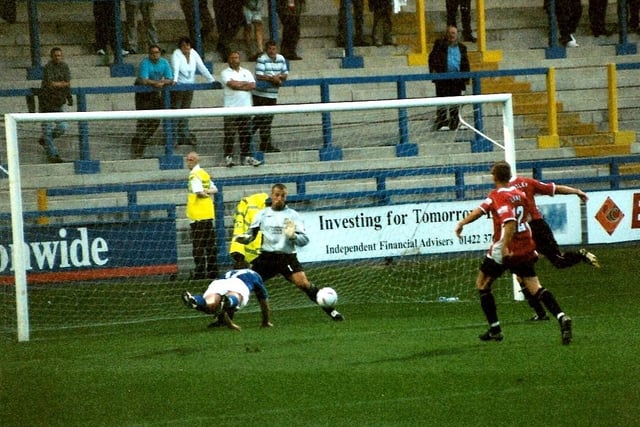 Dave Cameron scores the winner for Halifax with a diving header at home to Morecambe on August 12, 2003