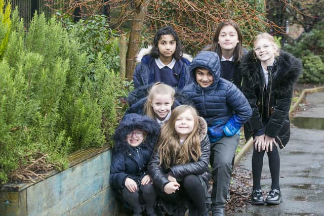 West Vale Academy wins grant to make a green wall. Back, from the left, Wamika Singh, 11, Talha Hassan, 10, Florence Widdowson, 11, and Leila Chantler-Brown, 10. Front, Phoebe Sutcliffe, six, Sofia Jensen, nine, and Isabella Heppleston, seven.
