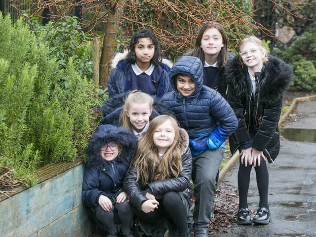 West Vale Academy wins grant to make a green wall. Back, from the left, Wamika Singh, 11, Talha Hassan, 10, Florence Widdowson, 11, and Leila Chantler-Brown, 10. Front, Phoebe Sutcliffe, six, Sofia Jensen, nine, and Isabella Heppleston, seven.