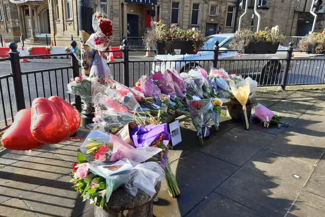 More flowers have been placed on Commercial Street outside the Victoria Theatre in Halifax in memory of Haidar Sha and Joshua Clark