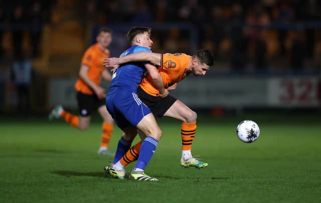 HALIFAX, ENGLAND - MARCH 20: Ryan Colclough of Chesterfield is challenged by Tylor Golden of FC Halifax Town during the Vanarama National League match between FC Halifax Town and Chesterfield at The Shay on March 20, 2024 in Halifax, England.  (Photo by George Wood/Getty Images)