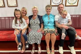 From left: Dawn Brown with grand-daughter Thea Brown on her knee, Ann Skinner, Linda O'Hara, Nathan Brown and his son Arthur Brown on his knee