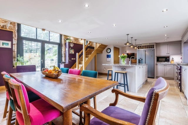 A spacious dining area links to the kitchen, with staircase to the first floor.