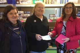 Hebden Bridge WI President Wilma Downs (left) with Sue Knowles from Todmorden Food Drop In and Hebden Bridge WI Treasurer Valerie Cryne (right).