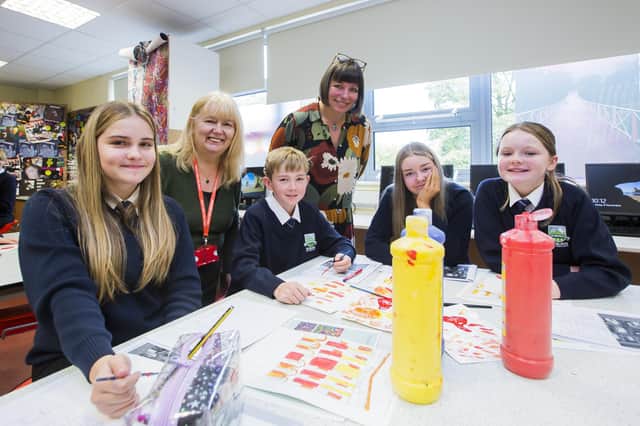 Students at Ryburn Valley High School asked to design a logo for Foundry Street Community Centre. From the left, Olivia Kershaw, 12, Sheila Eastwood from the Foundry Street Community Centre, Carter Mitchell, 13, Head of Art Yvette Hughes, Ruby Leeming, 13, and Sophie Oxley, 12.