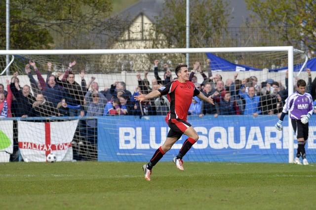 Halifax's Lee Gregory runs to the fans celebrating his goal at Guiseley