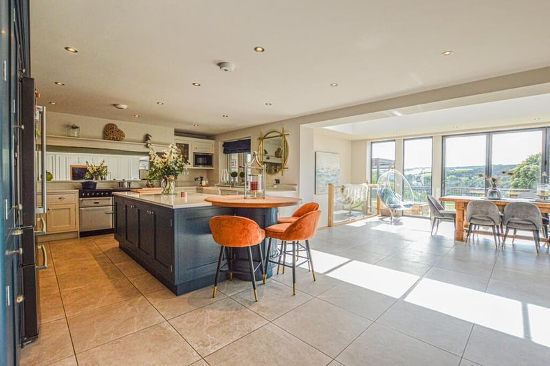 The open plan living kitchen with dining area, and views.