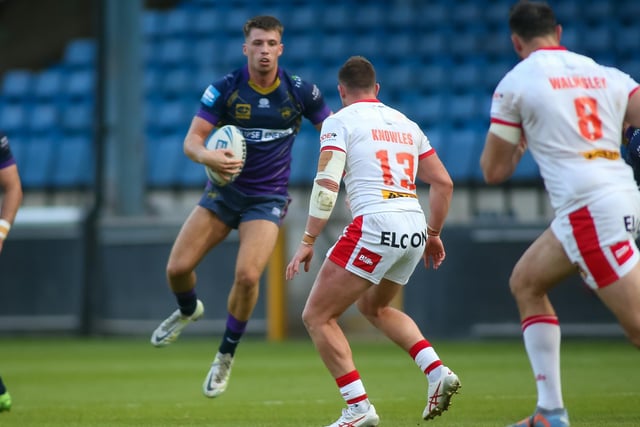 Ben Tibbs of Halifax looks for a gap in the St Helens defence