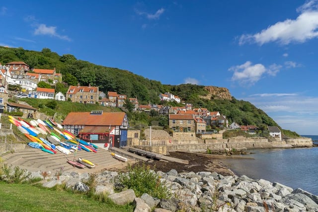 Runswick Bay with its red-roofed fishing village cottages has a small sandy beach that’s sheltered by surrounding cliffs.