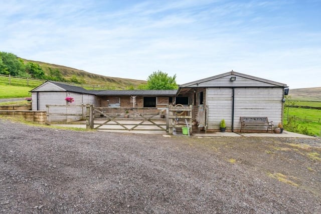The property includes four stables, arena and paddock grazing