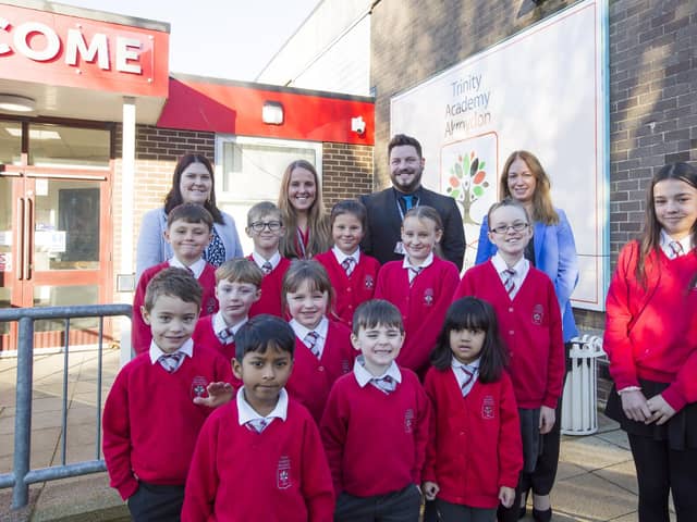 Trinity Academy Akroydon school gets good Ofsted report. Children from reception, year one and year six with, from the left, assistant principals Jemma Bentley and Emma Brindley, principal Oliver Grant-Roberts and trust director of primary Emma Hanlon-Gosling.