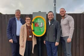 Neil Davidson, Jess Heald (Calderdale Council’s Healthy Holidays Coordinator), Simon Ferris and Mark Sharp with one of the newly installed defibrillators.