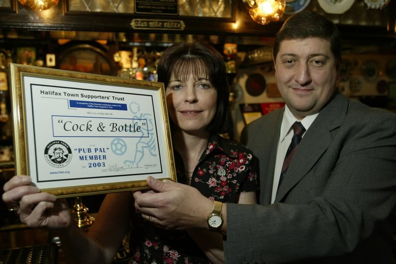 Landlady of the Cock and Bottle Pub at Southowram Margaret Pearson receives a certificate to mark her membership of the Pub PAL scheme from Peter Stajic, Commercial Manager for the Halifax Town Supporters Trust, back in 2003.