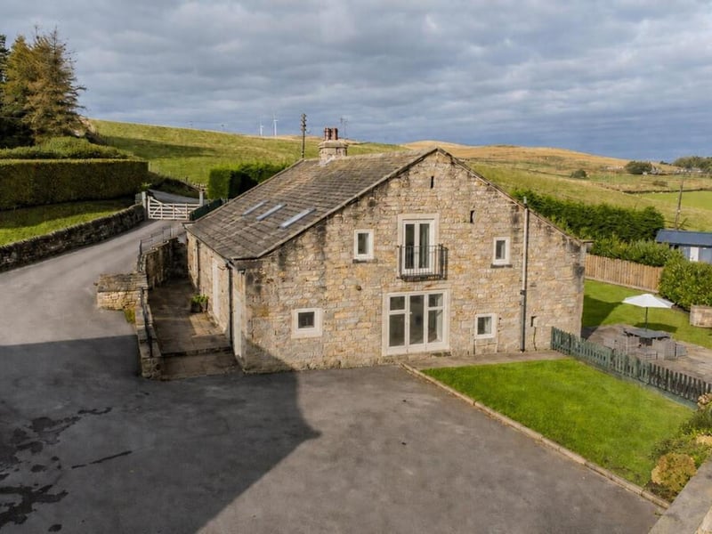This detached Grade II listed barn conversion is on the market for offers over £795,000.