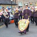 Principal cornet Tom Smith, with the British Open Shield, leads B&R as they march at Lees and Springhead in the Whit Friday contest earlier this month