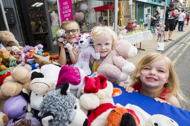From the left, George Robinson, five, Freya Hemmings, four, and Mia Robinson, two, at the Overgate Hospice stall.