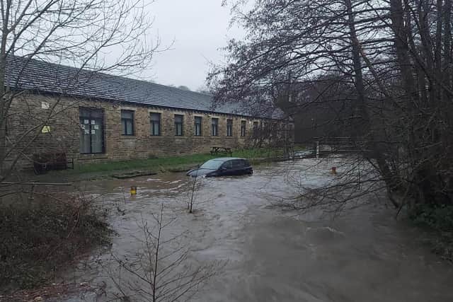 The car was trapped in high flood water
