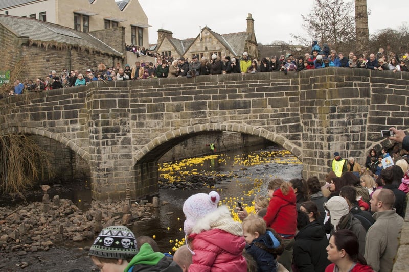 Big crowds cheer on their duck at the 2013 Hebden Bridge Duck Race
