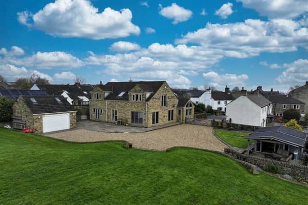 This detached home in Hipperholme is on the market for £1,100,000 with Charnock Bates.