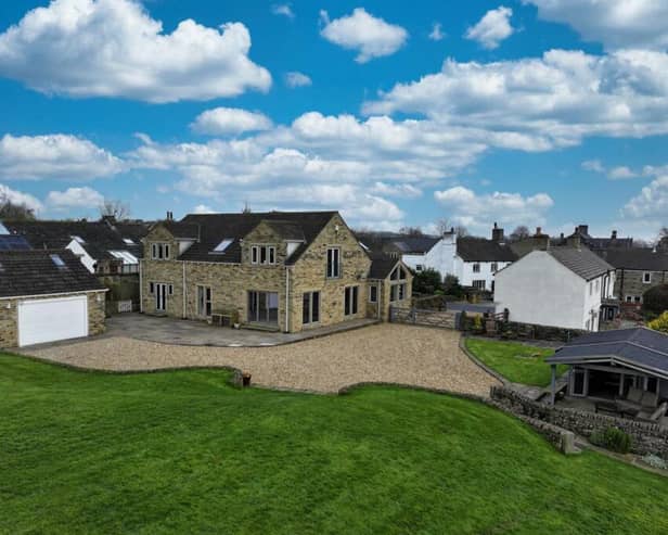 This detached home in Hipperholme is on the market for £1,100,000 with Charnock Bates.