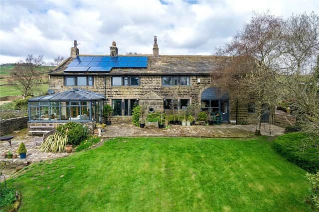 This four bedroom farmhouse with land, in Hey Head Lane, Todmorden, is attracting interest, priced at £750,000.