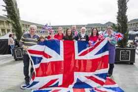 Piece Hall Traders prepare for the Coronation of King Charles III. From the left, John Fellows from Flockitt and Broom, Eva Sargent, nine, and Ethan Sargent, 11, from Al's Emporium, Kate Owen from House of 925, Lou Harkness Hudson from Hudson Belle, Mark Richardson from Loafers, Jackie Rownsley from The Chocolate Box, Yvonne Entwhistle from Brown Paper Packages, and Jayne Spence from Creative Crystals.