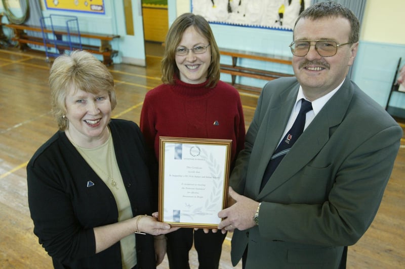 A 2003 presentation of an Investor in People Award to St Augustines CofE J&I School.  Mags Archer, Headteacher, Helen Austwick, Chairman of Governors, and Joe Henry, Workforce Development Advisor.