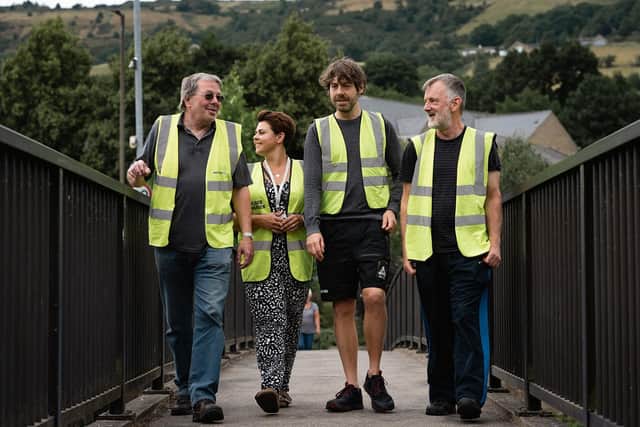 Coun Scott Patient, third from the left, with fellow flood wardens at completed flood defence works in Mytholmroyd