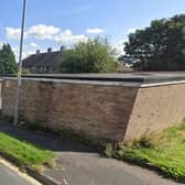 The site at Sherburn Road, Rastrick, currently houses garages. Picture: Google