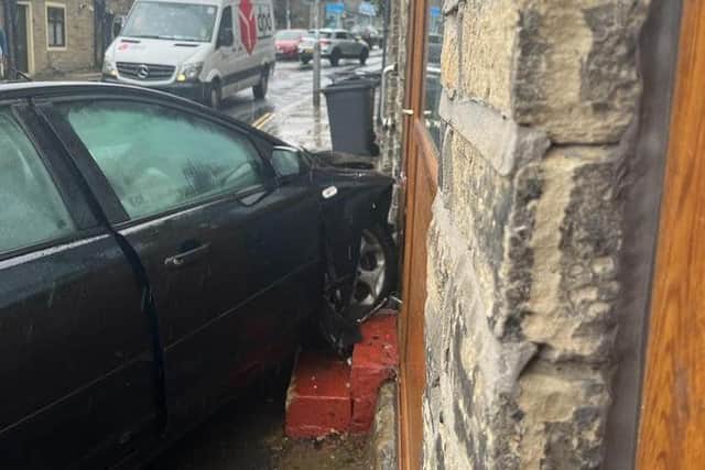 The car smashed into Northowram Fisheries on Tuesday afternoon