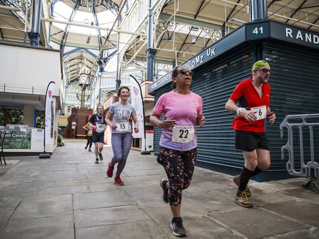Halifax Urban Trail run through the town's iconic landmarks for Overgate Hospice. Calderdale Borough Market