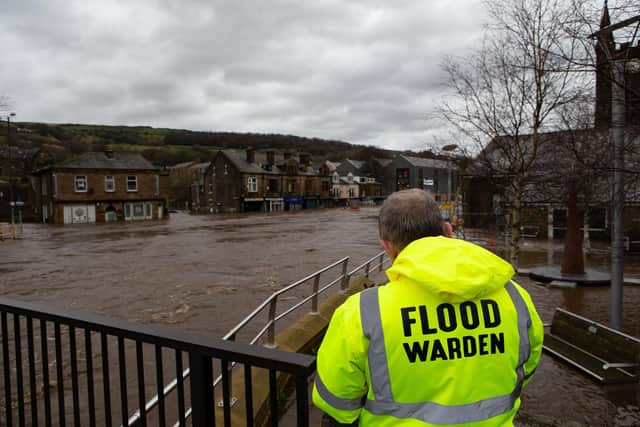 Flood Wardens keeping an eye on the flooding in Mytholmroyd back in 2020