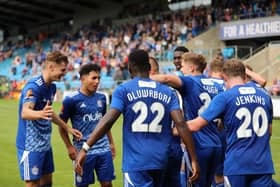 Town celebrate a goal in their opening day win over Barnet