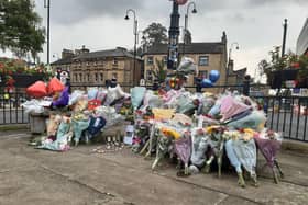 Flowers and other tributes left for Haider Shah and Joshua Clark in Halifax town centre after they were killed