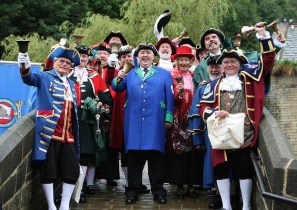Les Cutts (centre) with other town criers at an event in Hebden Bridge