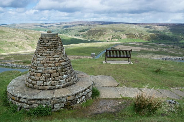 Cairn and seat overlooking Buttertub pass and Swaledale in the Yorkshire Dales