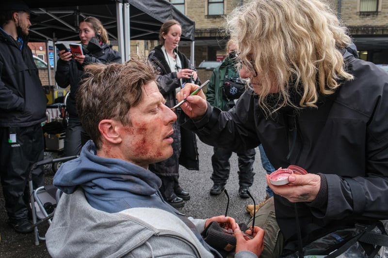 James Norton gets a make-up touch-up during filming for the final episode.