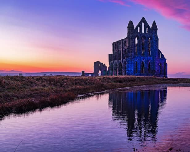 The sun sets as the Illumination of Whitby Abbey starts which runs over Halloween half term week.
