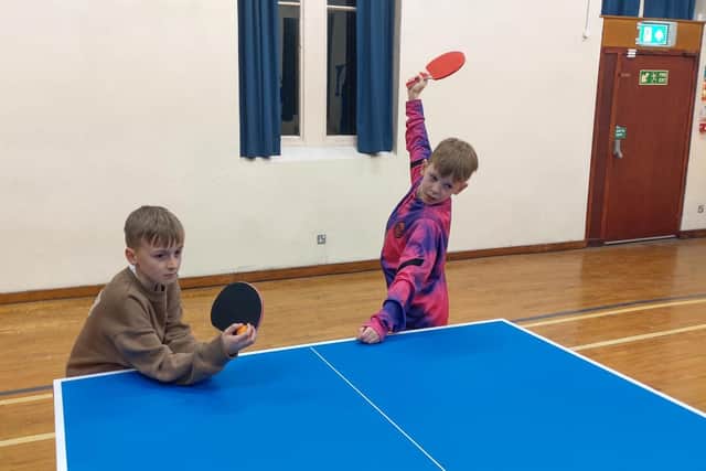 Playing table tennis at the community centre